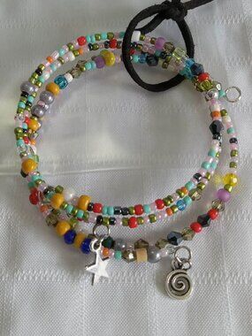 E - Handmade memory wire bracelets set with beads and pendants